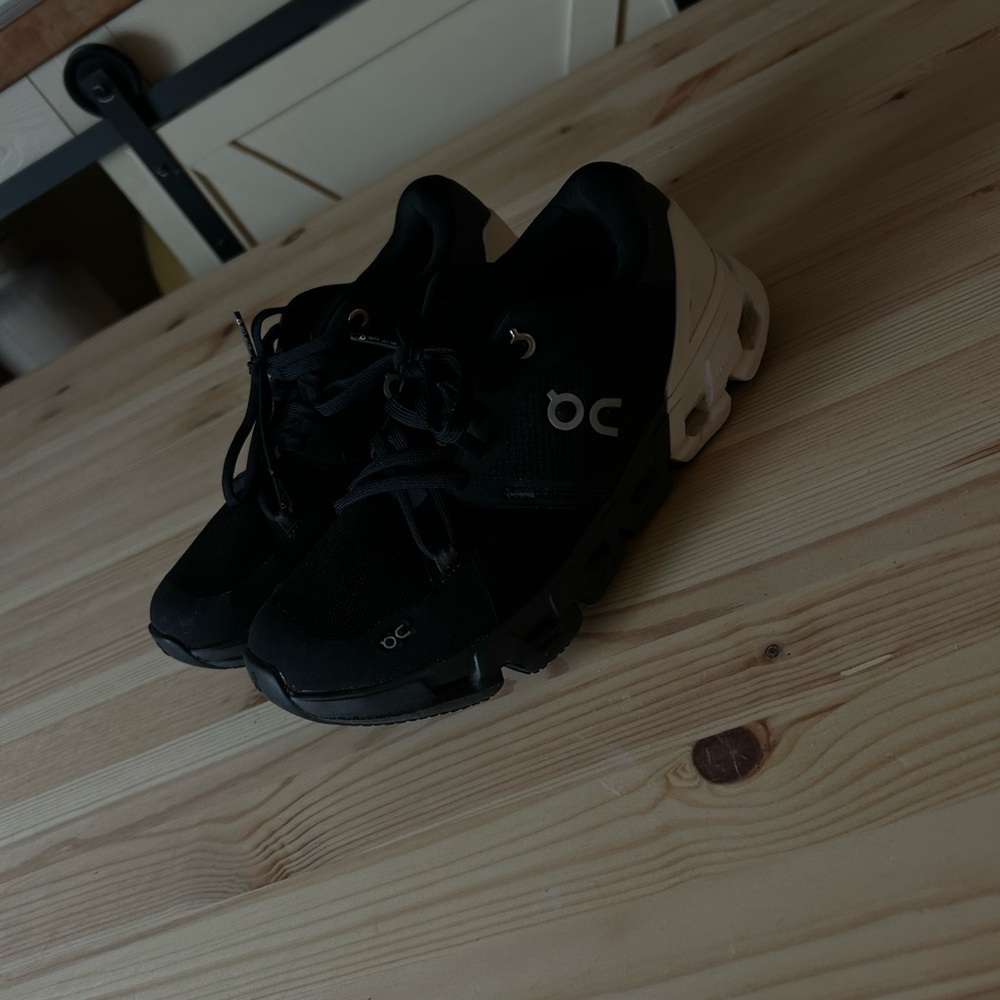 On Running Black and Cream Athletic Shoes